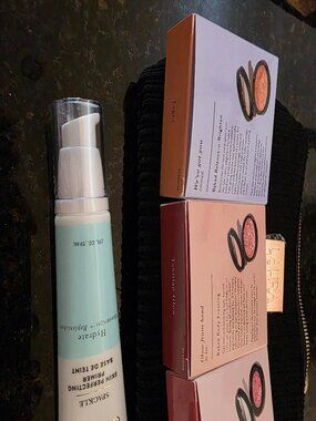 Laura Geller Everyday Kit Primer, Foundation, Bronzer, & Blush in a Black Bag
